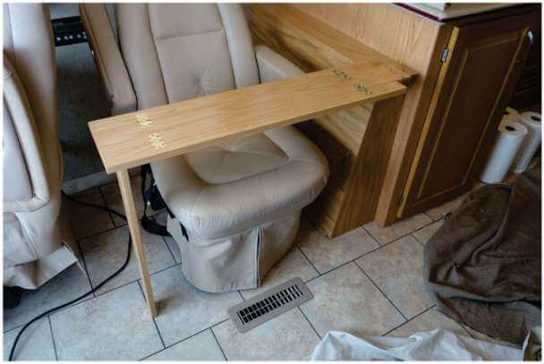 Fold away table pulled out in front of chair